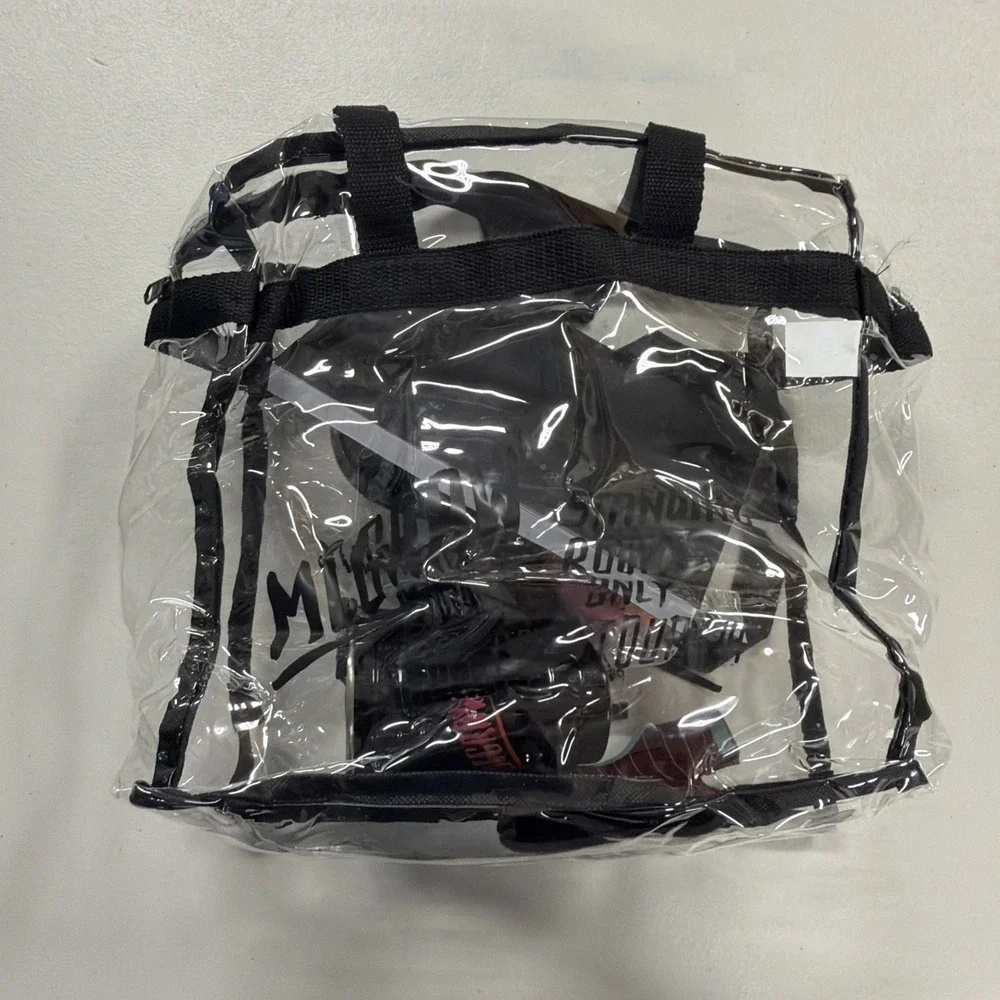 collection of McGraw-branded tour merchandise, including a clear tote bag 2024